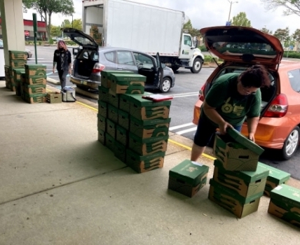 Market Managers preparing to deliver local seasonal produce and artisan goods